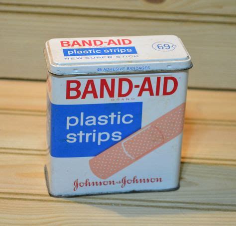 metal band aid boxes|bandaids in a metal container.